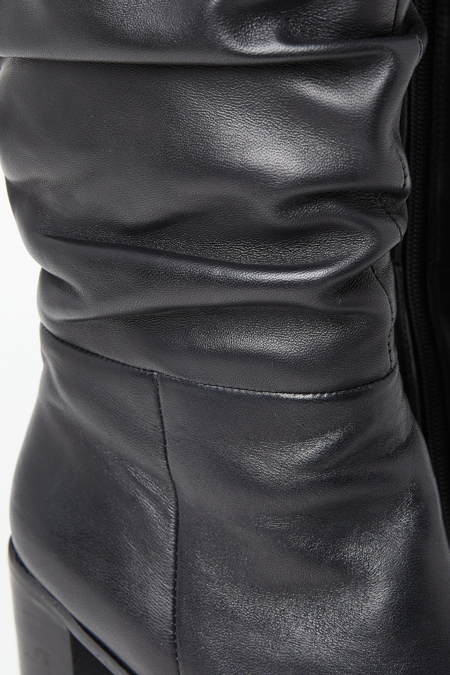 Edit No9. Close up of black leather ruched knee boots. Large sizes.