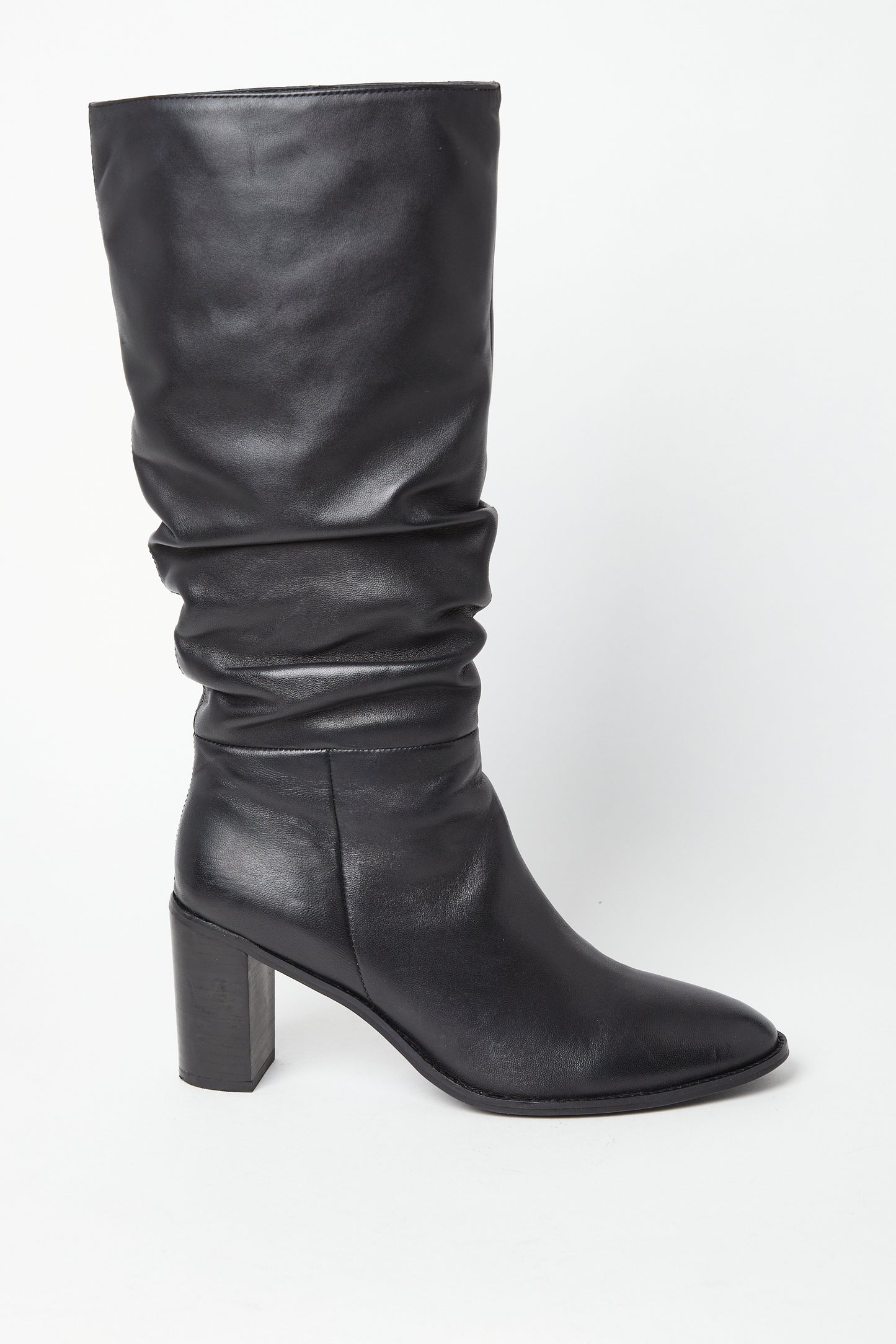 Edit No9. A single black leather ruched knee boot with a round-toed silhouette and a high block heel. Large sizes.