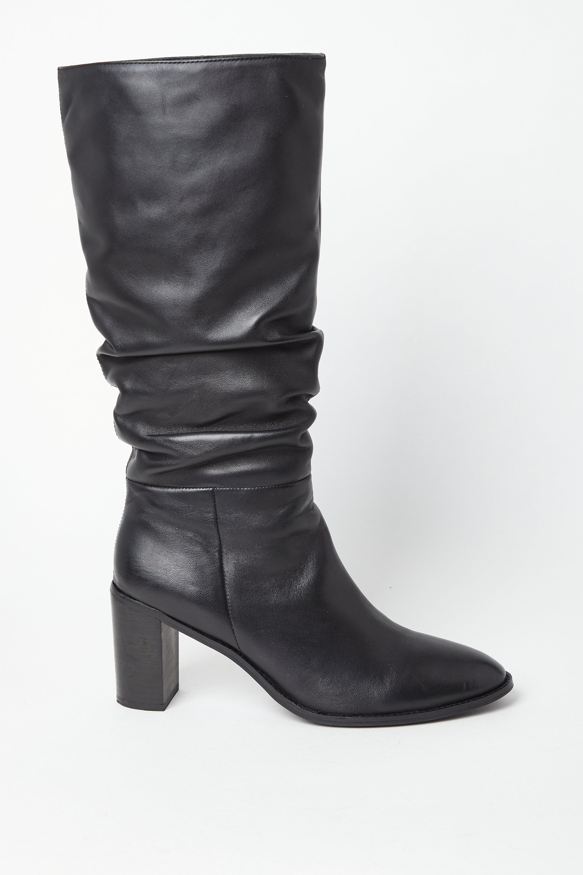 Edit No9. A single black leather ruched knee boot with a round-toed silhouette and a high block heel. Large sizes.